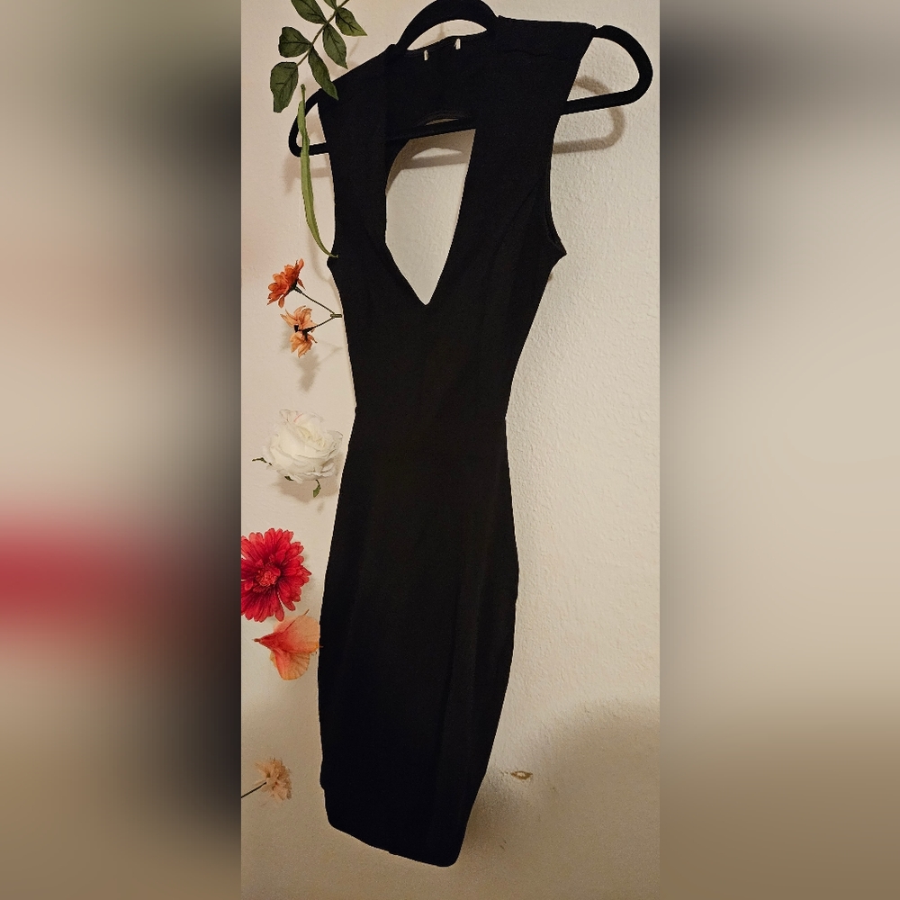 Black cocktail dress with cutout waist and back